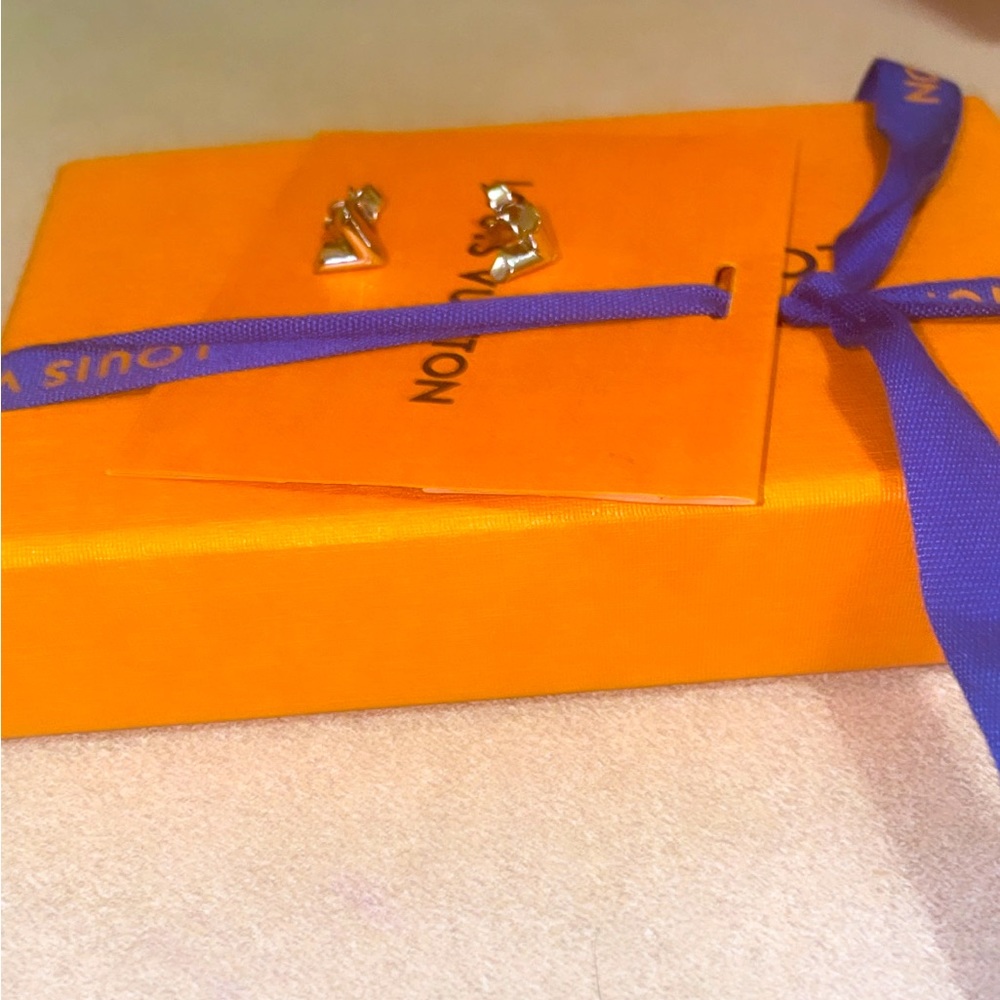 Lv silver earrings, Brand New.